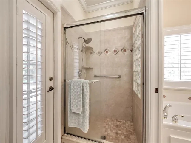 a view of a swimming pool with a table and chairs