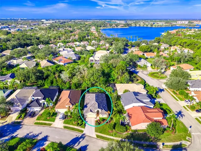 a front view of a house with a garden and plants