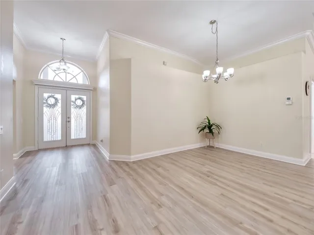 a kitchen with stainless steel appliances a refrigerator sink and microwave