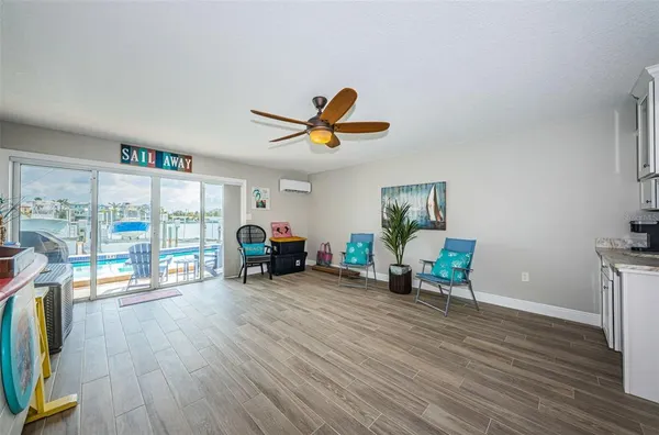 a living room with furniture a fireplace and a table