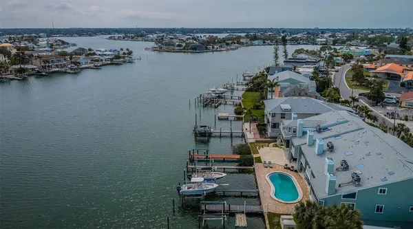 an aerial view of a house with a lake view