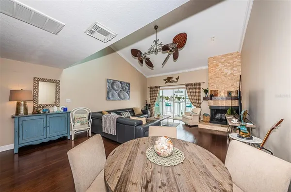 a view of a dining room with furniture window and wooden floor