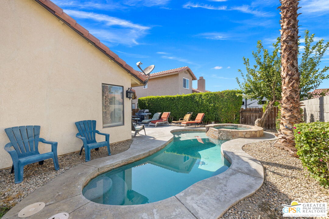 45688 Sutter Creek Road Indio, CA 92201 - Photo 42 of 51 a view of a swimming pool with chairs