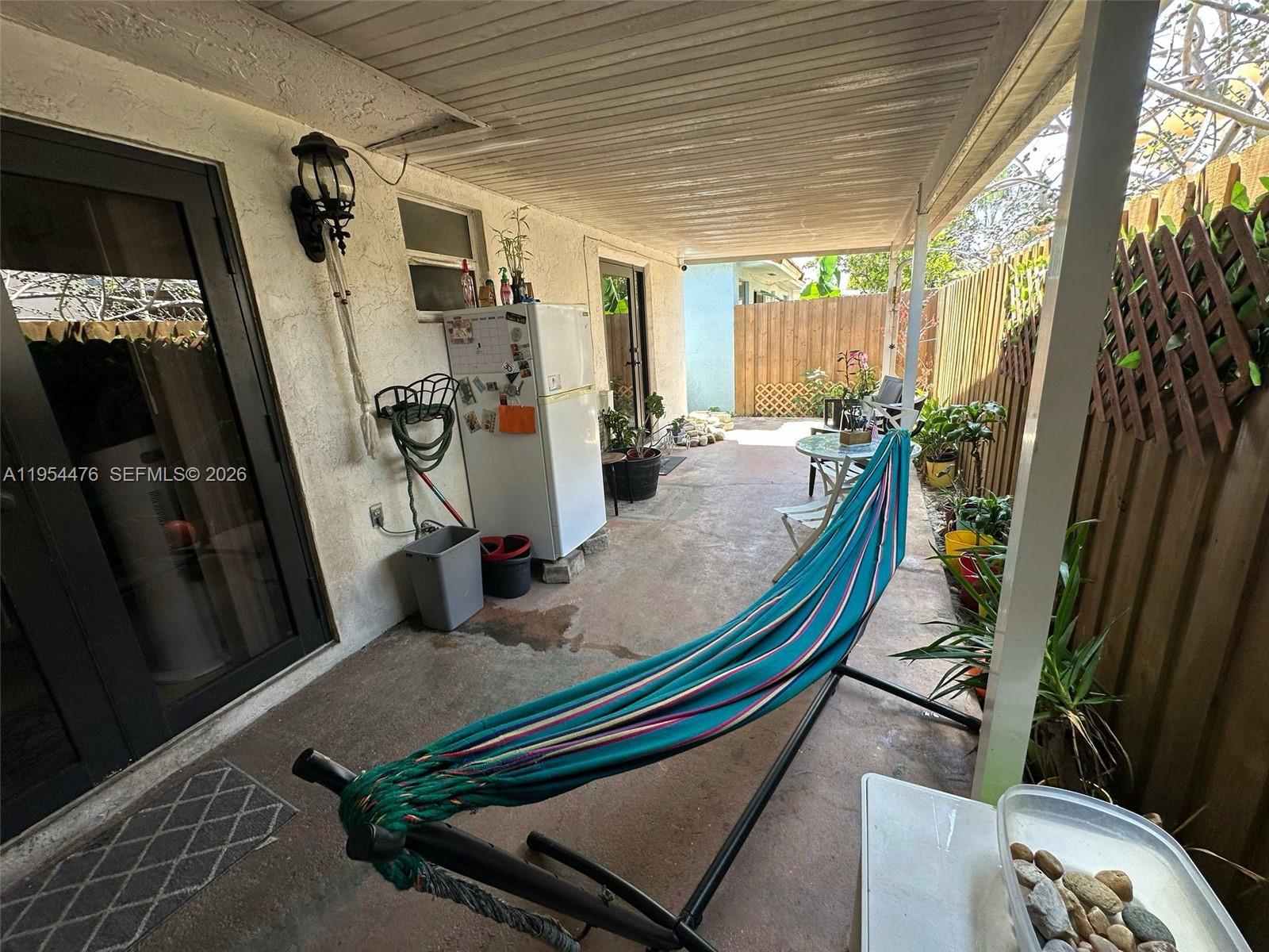 11537 Southwest 6th Street Sweetwater, FL 33174 - Photo 7 of 7 a living room with furniture fireplace and a flat screen tv