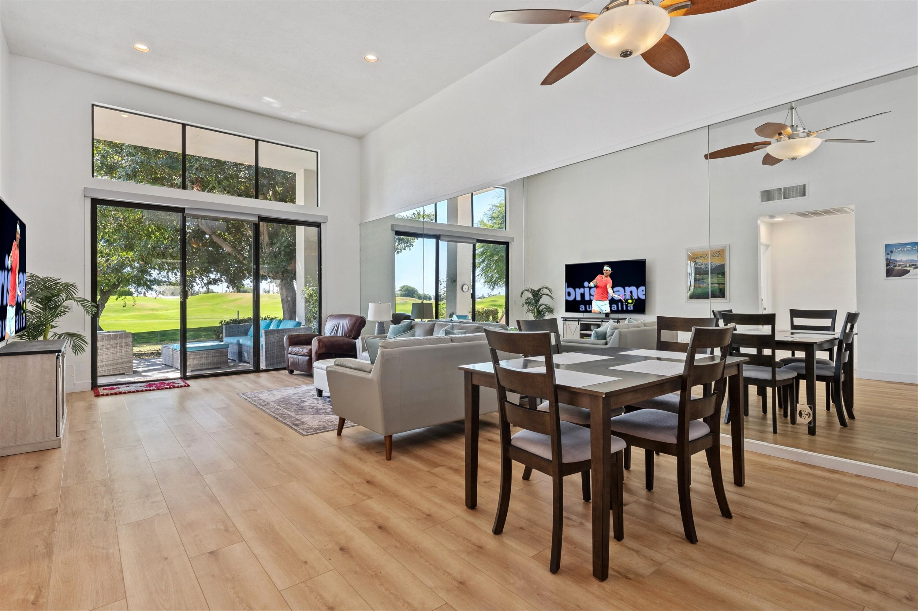 54326 Oak-Tree, Unit A122 La Quinta, CA 92253 - Photo 1 of 32 a view of a dining room with furniture window and wooden floor