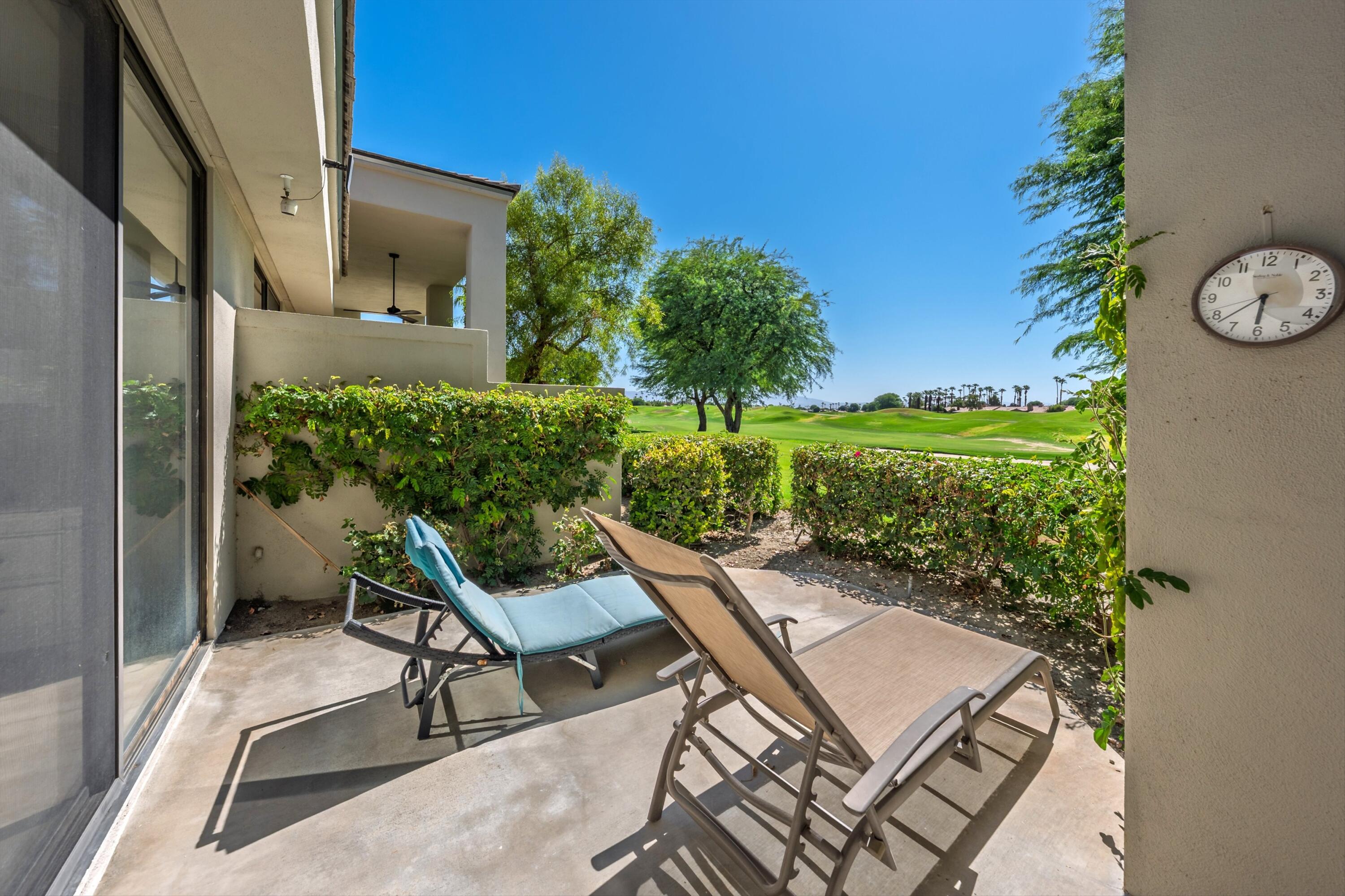 54326 Oak-Tree, Unit A122 La Quinta, CA 92253 - Photo 24 of 32 a view of a chairs and table in patio