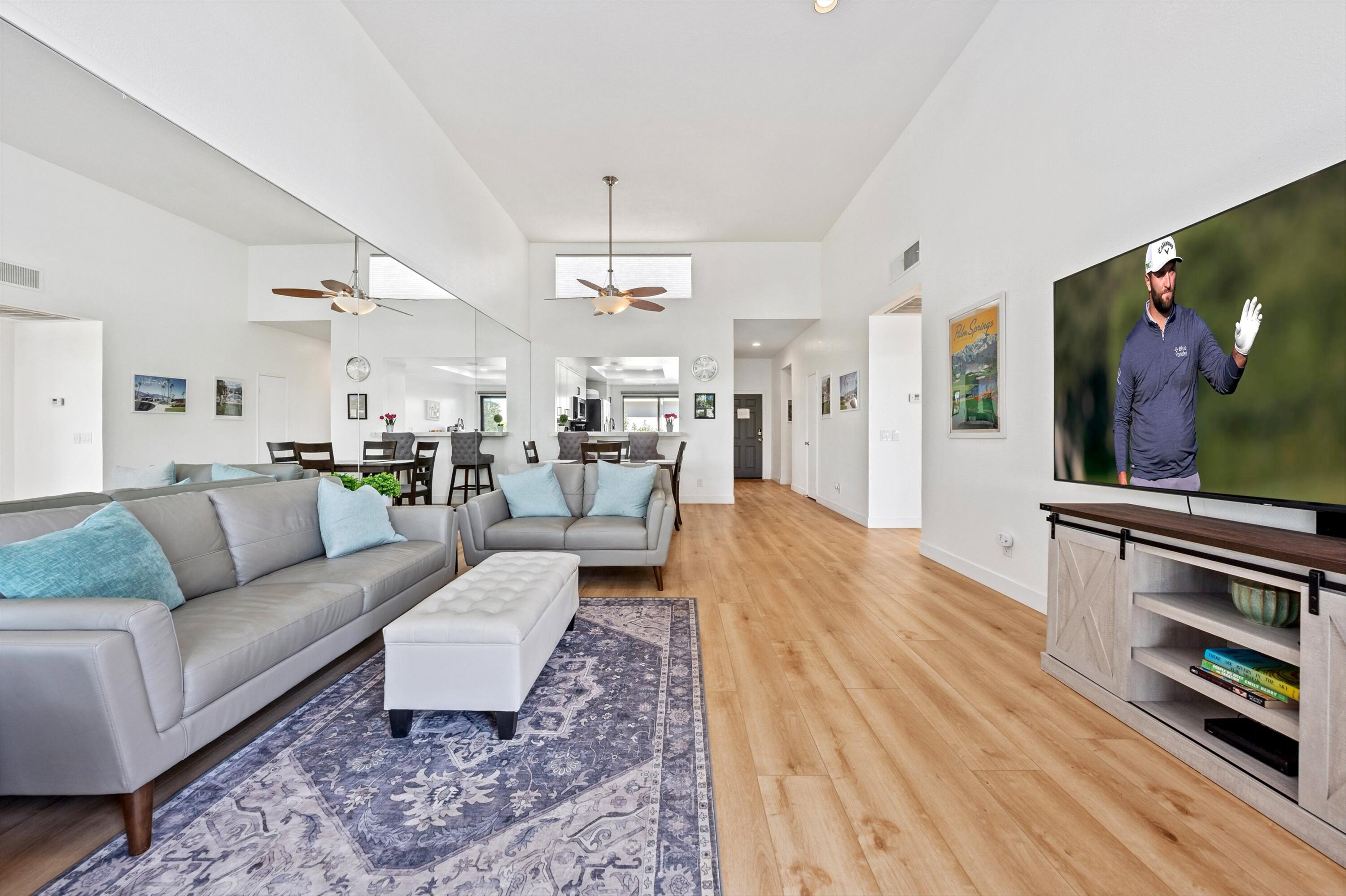 54326 Oak-Tree, Unit A122 La Quinta, CA 92253 - Photo 4 of 32 a living room with furniture and a flat screen tv