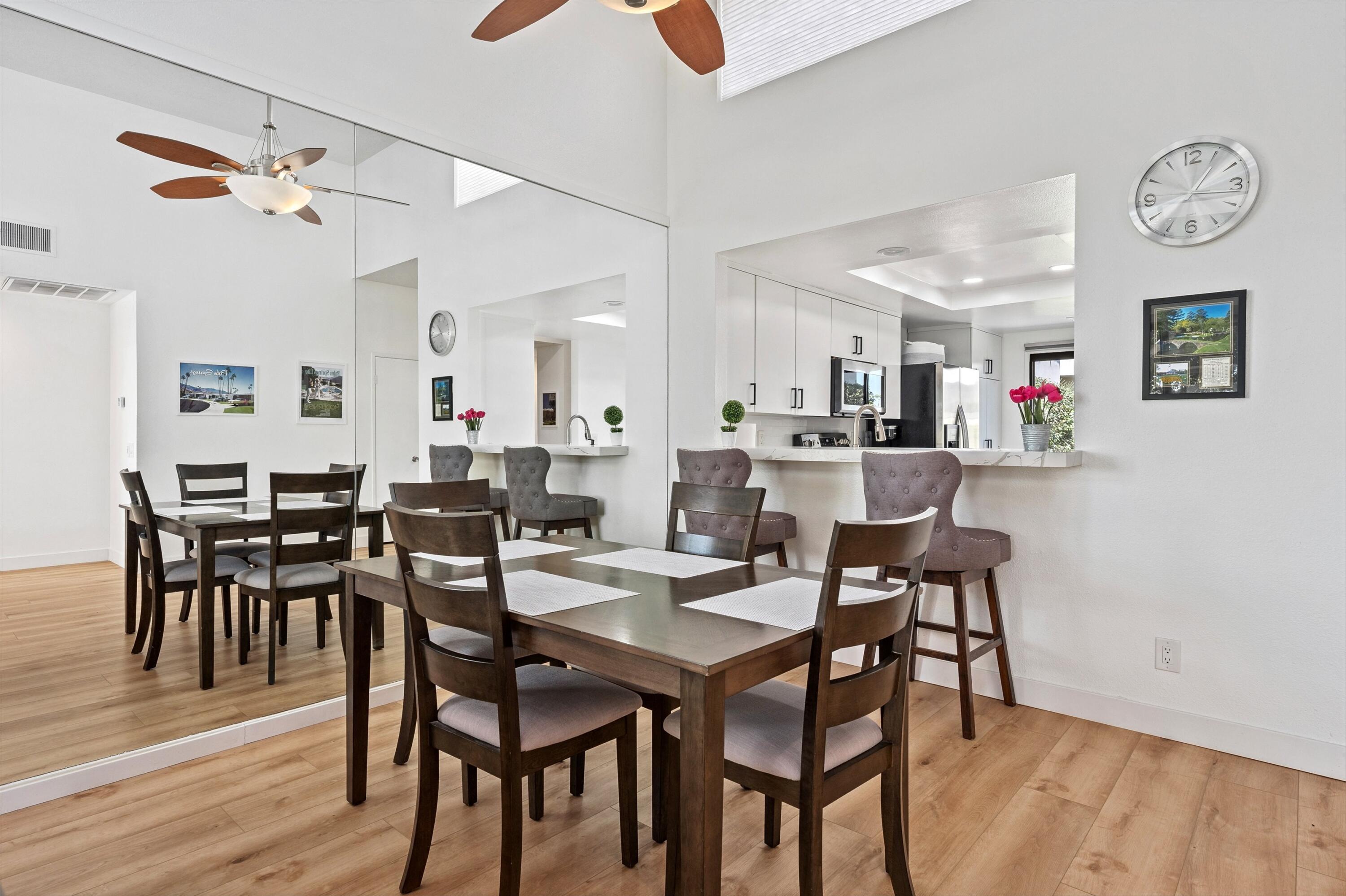 54326 Oak-Tree, Unit A122 La Quinta, CA 92253 - Photo 6 of 32 a view of a dining area with furniture and wooden floor