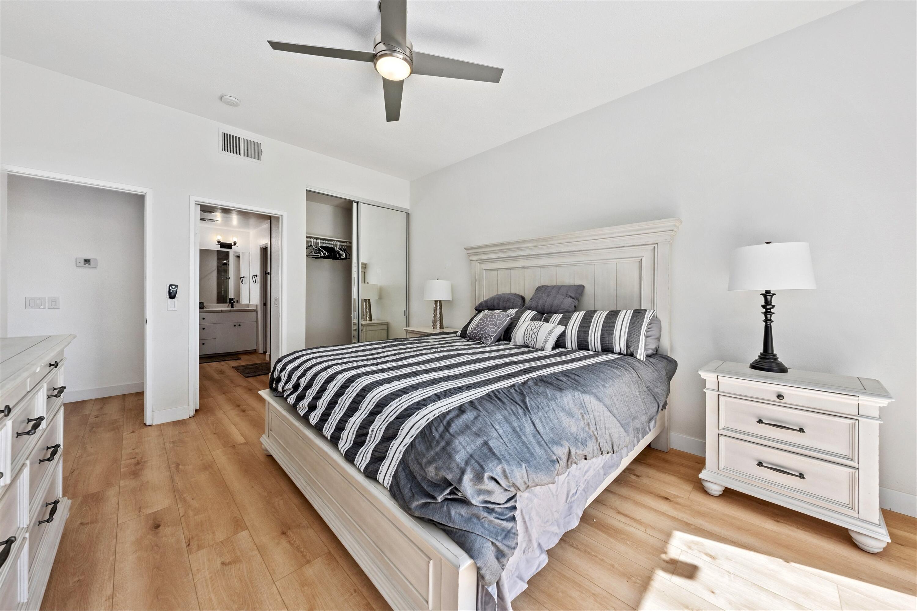 54326 Oak-Tree, Unit A122 La Quinta, CA 92253 - Photo 10 of 32 a bedroom with bed and walk in closet