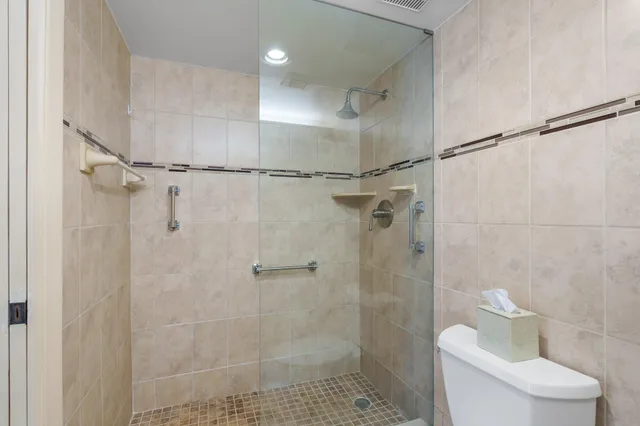 a bathroom with a shower and toilet