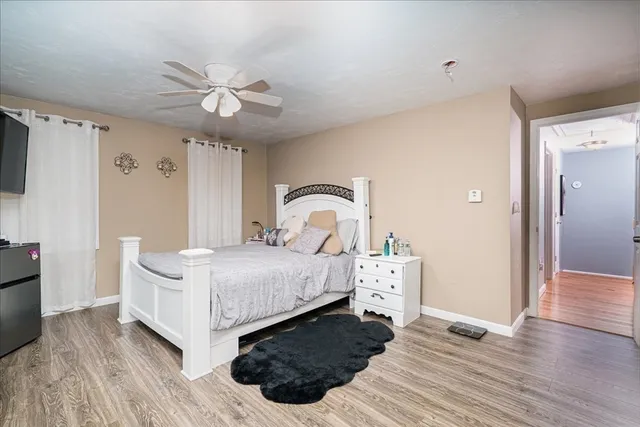 a bedroom with a bed and a dresser