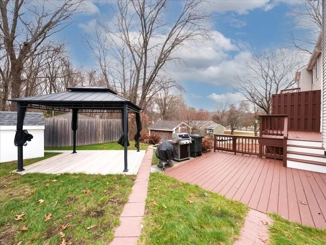 a view of a backyard with sitting area
