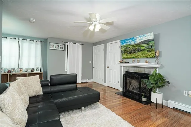 a living room with furniture and a fireplace