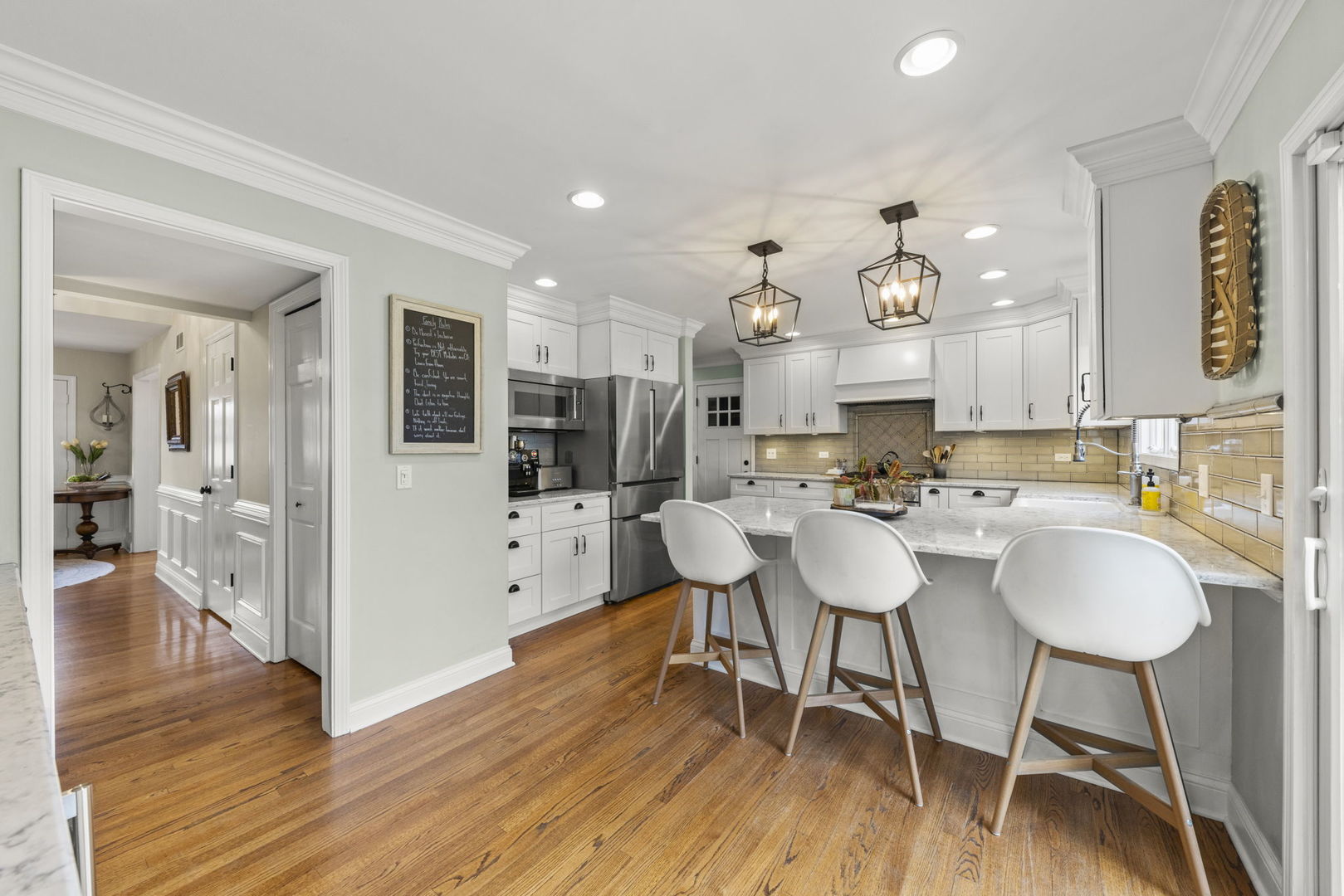 1908 Gladstone Drive Wheaton, IL 60189 - Photo 12 of 53 a view of a dining room with furniture and wooden floor