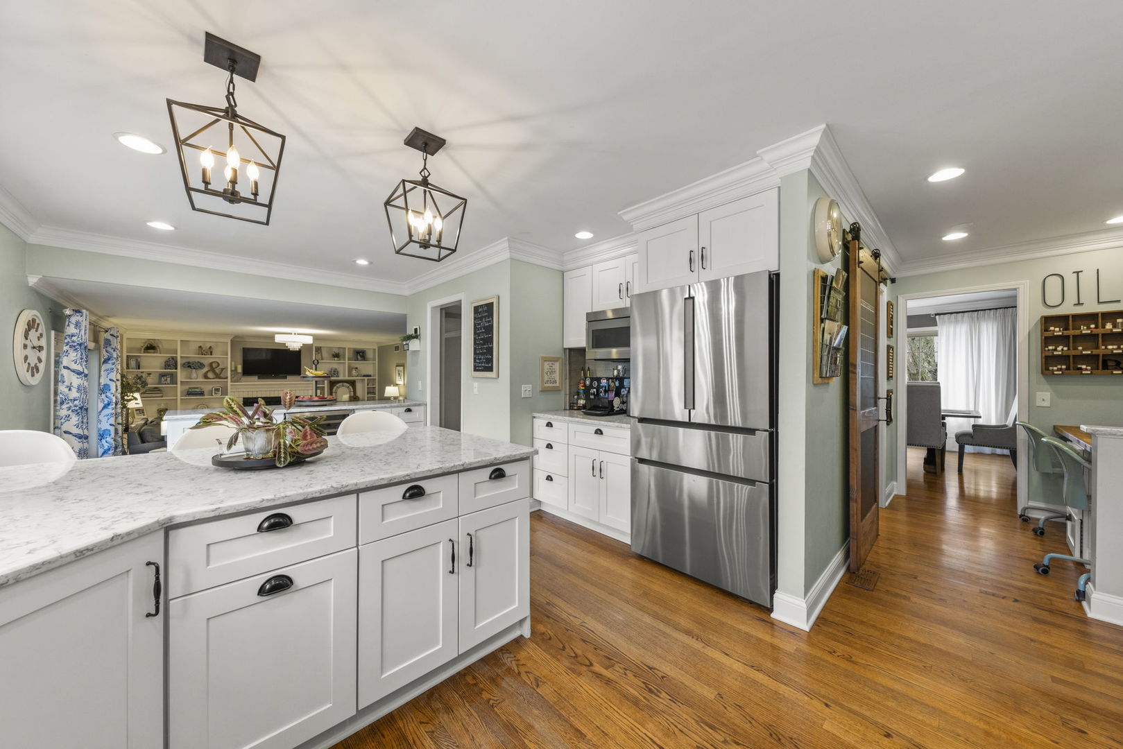 1908 Gladstone Drive Wheaton, IL 60189 - Photo 15 of 53 a kitchen with stainless steel appliances granite countertop a refrigerator a stove a sink dishwasher and a dining table with wooden floor