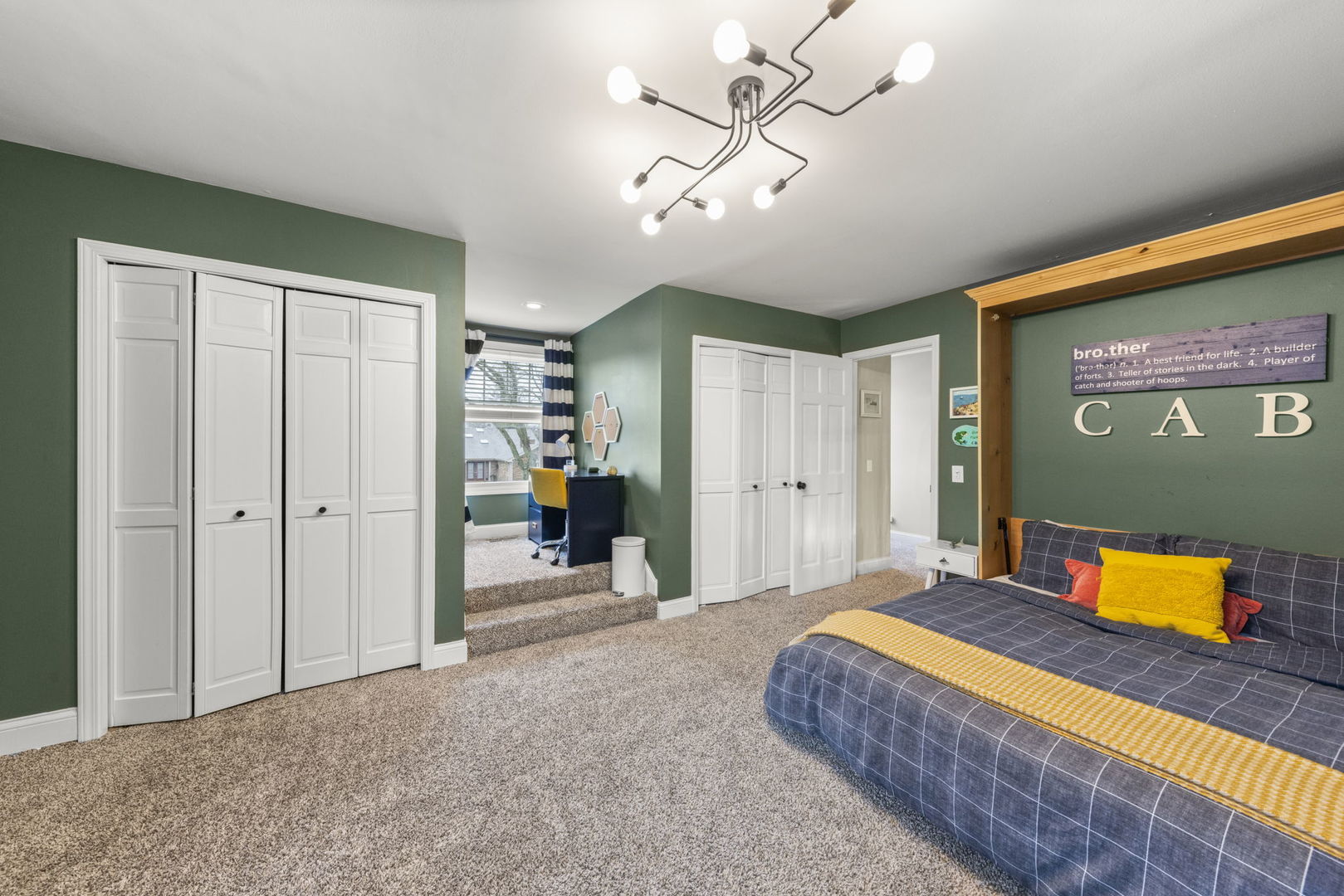 1908 Gladstone Drive Wheaton, IL 60189 - Photo 26 of 53 a bedroom with a bed and a chandelier