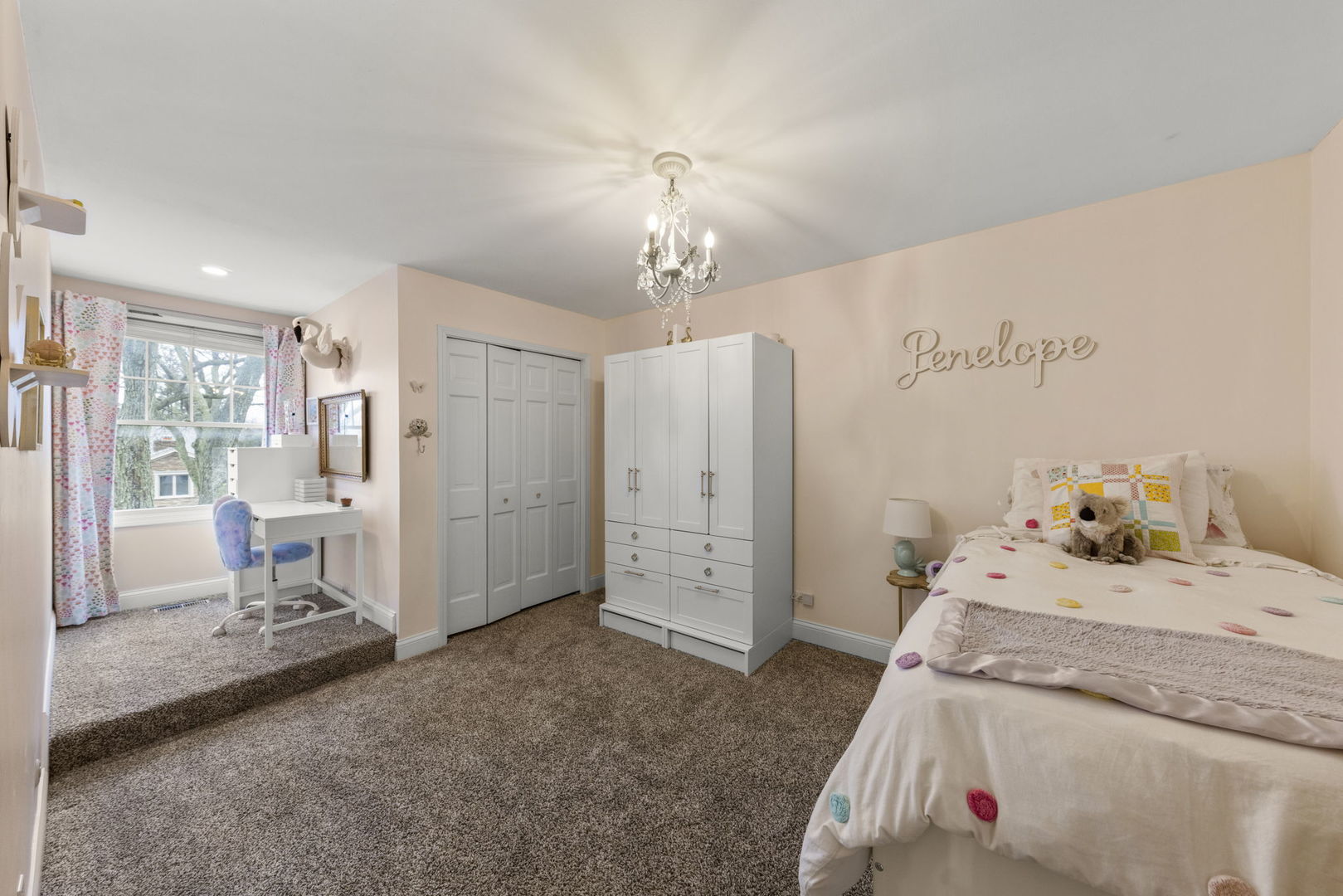 1908 Gladstone Drive Wheaton, IL 60189 - Photo 27 of 53 a bed room with a bed and a chandelier