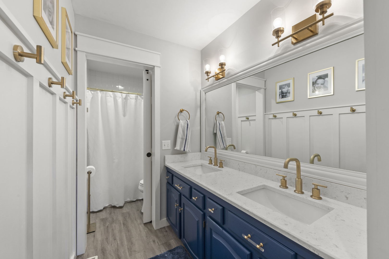 1908 Gladstone Drive Wheaton, IL 60189 - Photo 29 of 53 a bathroom with a double vanity sink and a mirror