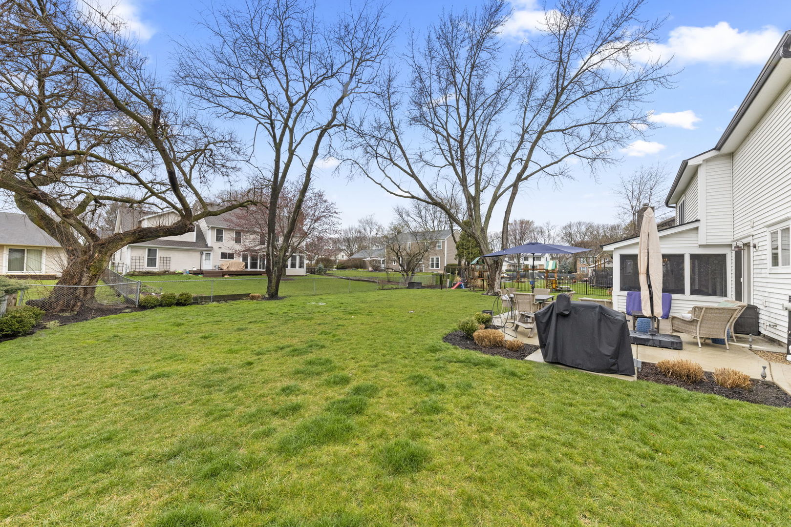 1908 Gladstone Drive Wheaton, IL 60189 - Photo 37 of 53 a view of a house with backyard and sitting area