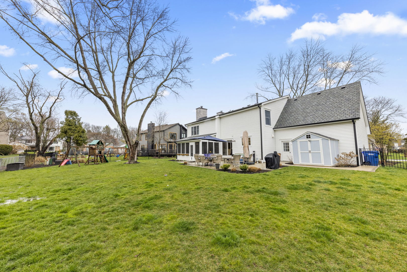 1908 Gladstone Drive Wheaton, IL 60189 - Photo 38 of 53 a view of a house with a big yard