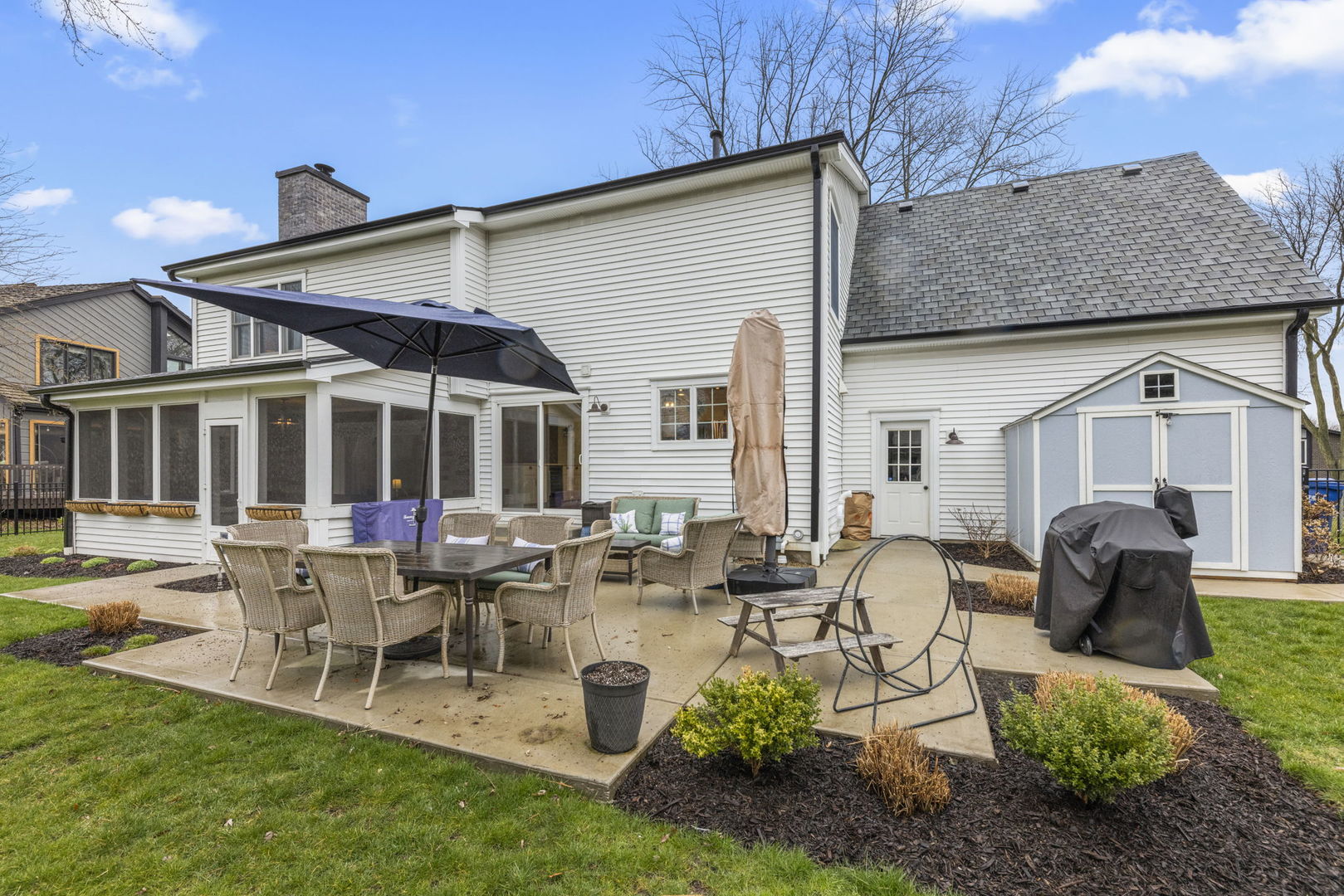 1908 Gladstone Drive Wheaton, IL 60189 - Photo 39 of 53 a building outdoor space with patio furniture and garden