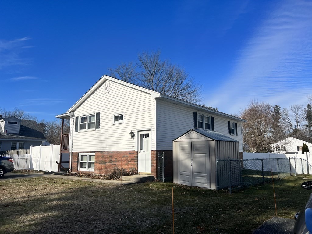 a view of a back yard of the house
