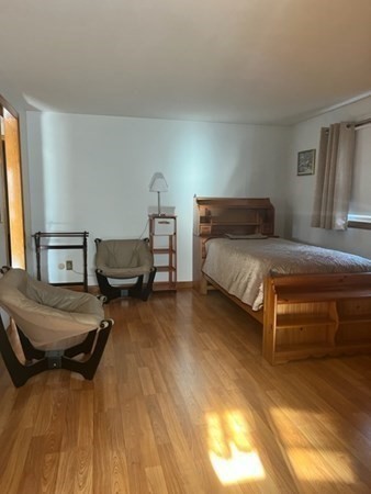 30-32 Joseph Street Springfield, MA 01119 - Photo 9 of 20 a bedroom with a bed and wooden floor