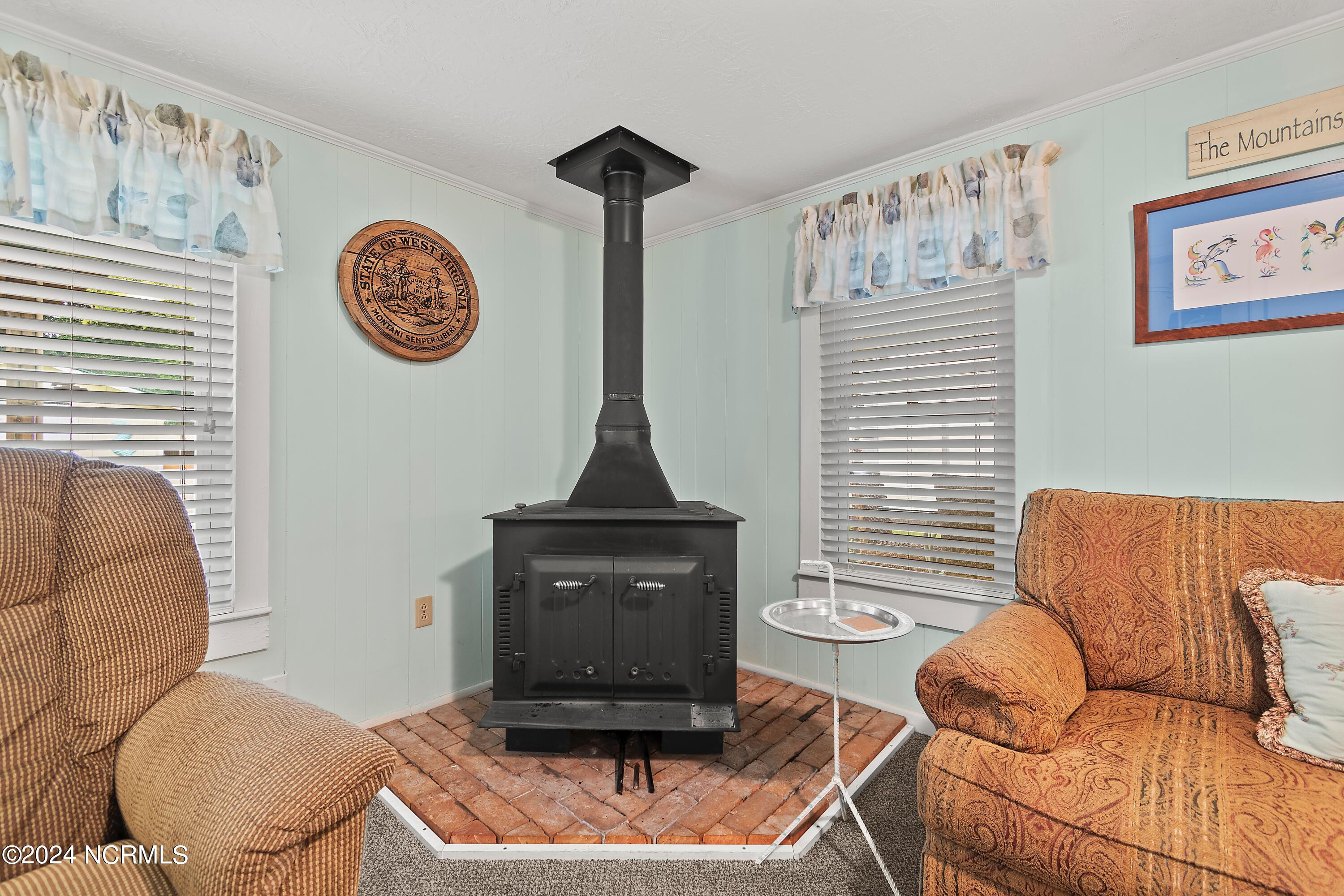 3105 Gal-Var Road Supply, NC 28462 - Photo 36 of 54 Wood stove in addition to heat pump