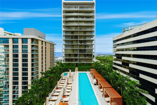 a view of balcony with wooden floor and a window