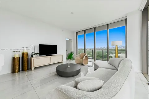 a view of a bathroom with a tub and a shower