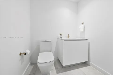 a view of a livingroom with furniture and a flat screen tv