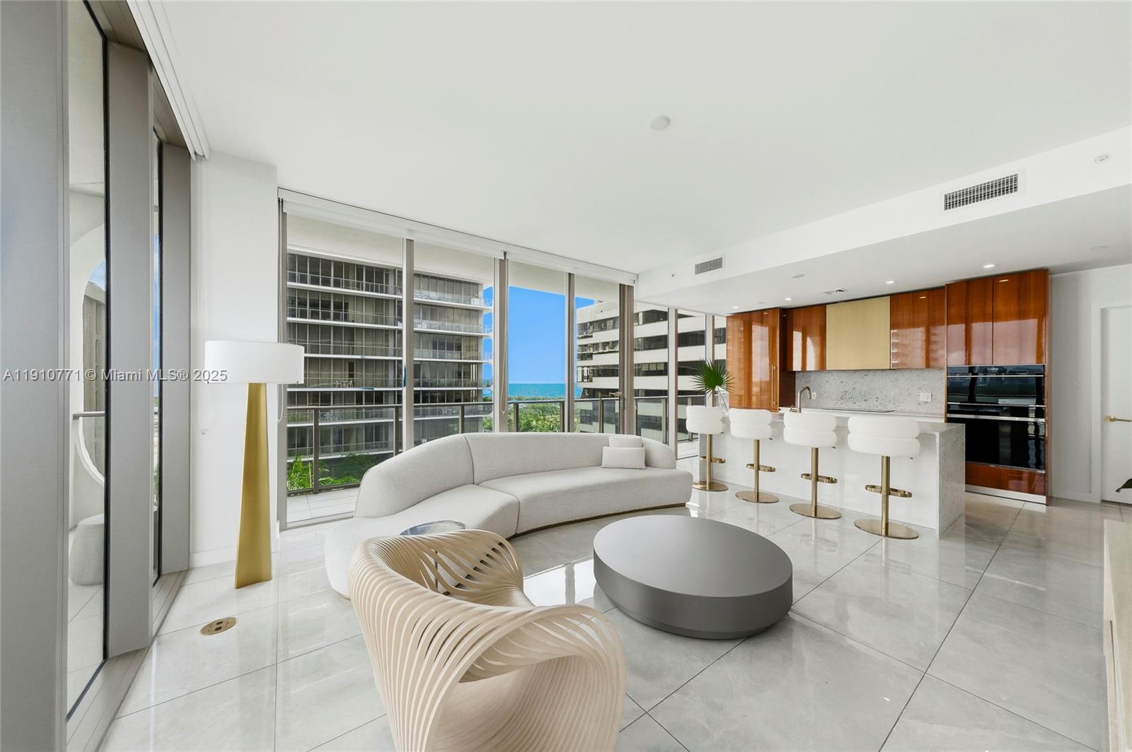 2678 Tigertail Avenue, Unit 1110 Miami, FL 33133 - Photo 39 of 77 a living room with furniture and a large window