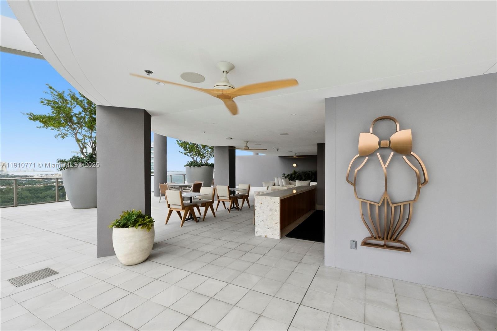 2678 Tigertail Avenue, Unit 1110 Miami, FL 33133 - Photo 48 of 77 a view of livingroom with furniture and potted plants