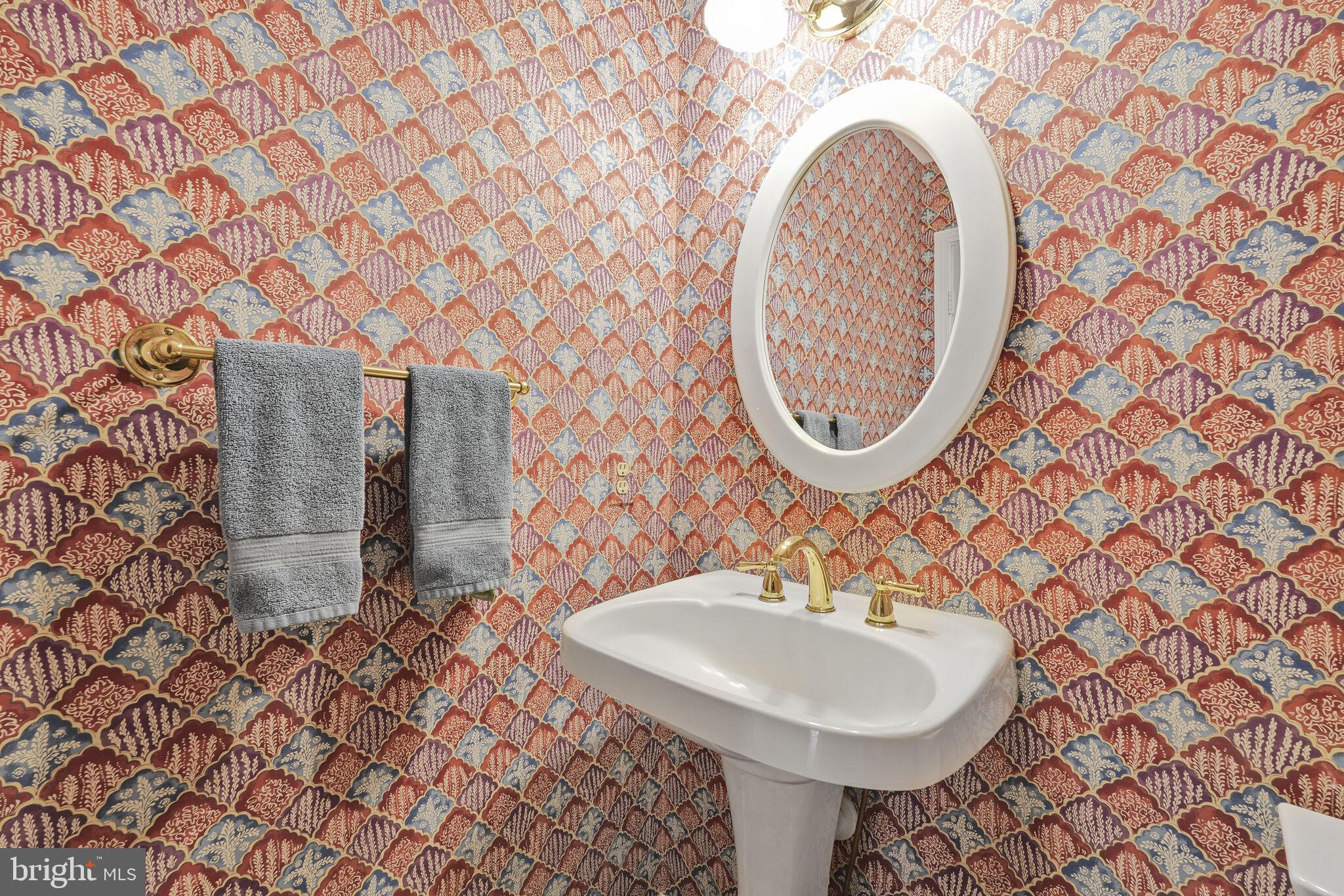 9501 Columbia Boulevard Silver Spring, MD 20910 - Photo 14 of 32 a bathroom with a sink and a mirror