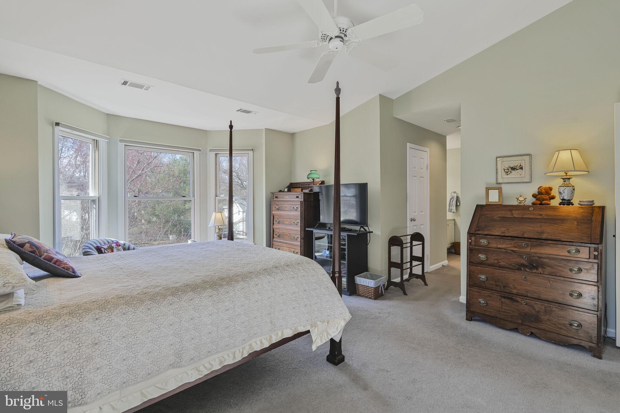 9501 Columbia Boulevard Silver Spring, MD 20910 - Photo 20 of 32 a bedroom with a bed and a dresser