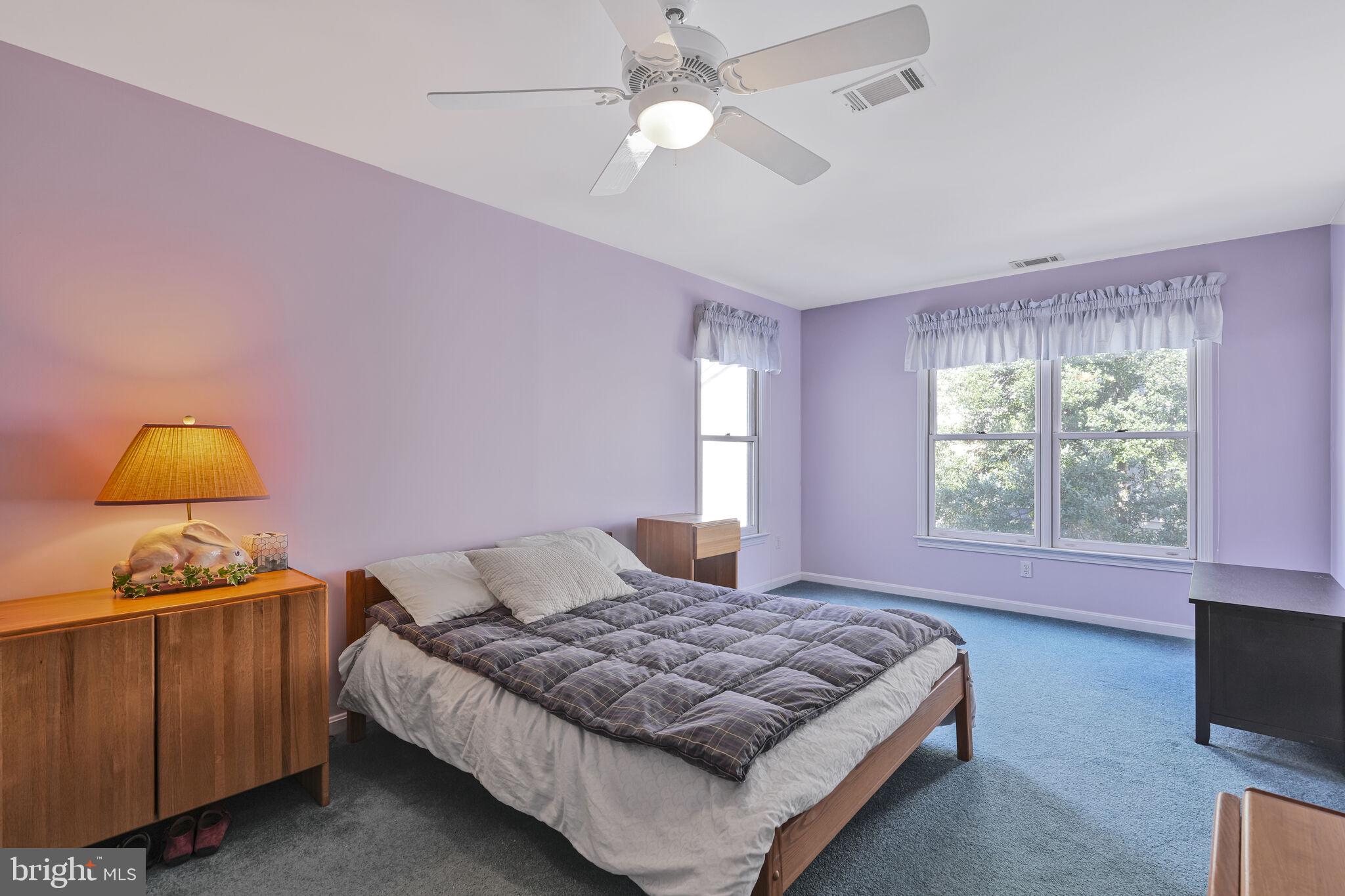 9501 Columbia Boulevard Silver Spring, MD 20910 - Photo 22 of 32 a bedroom with a bed and window