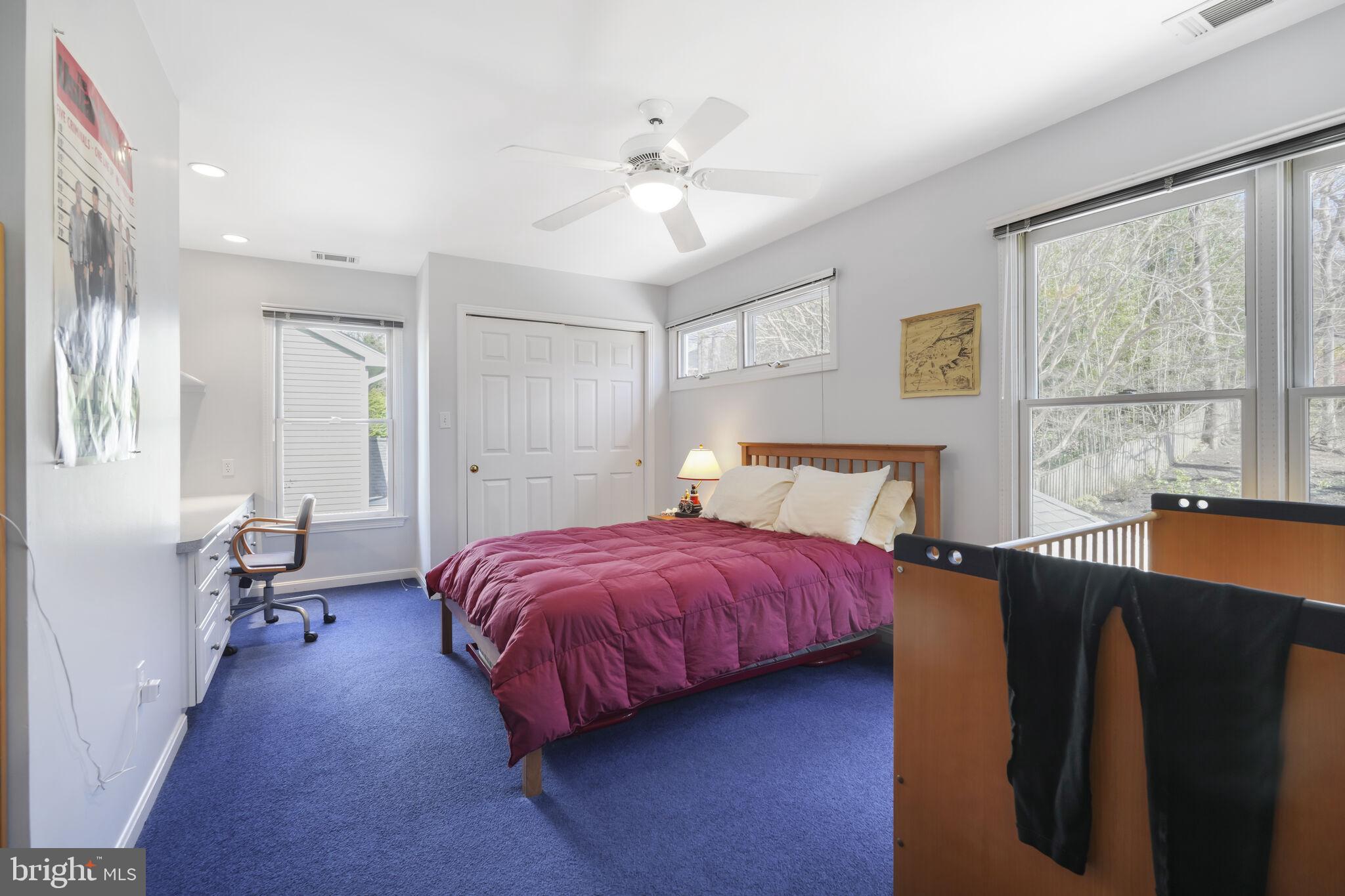 9501 Columbia Boulevard Silver Spring, MD 20910 - Photo 23 of 32 a spacious bedroom with a bed and window