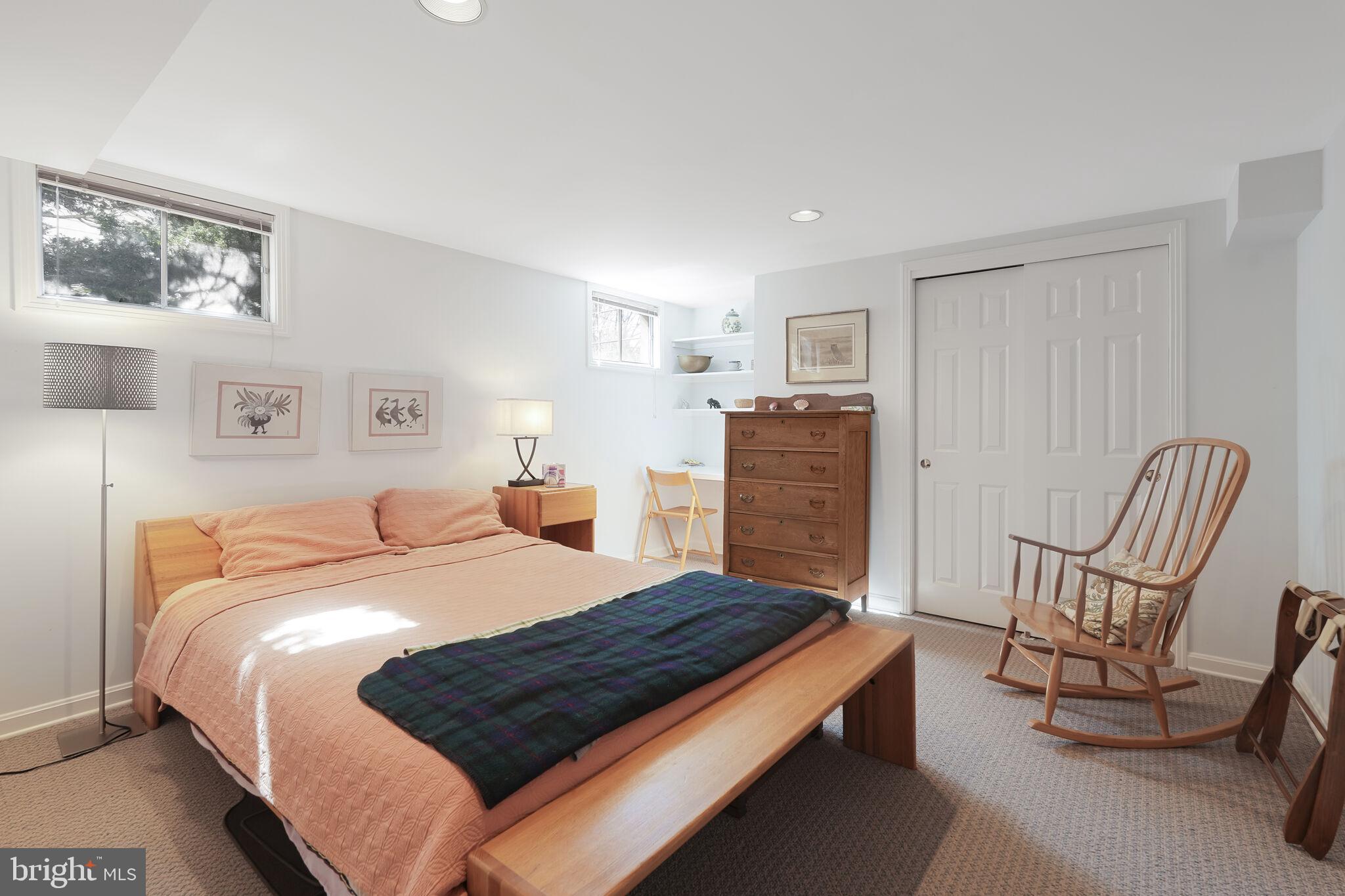 9501 Columbia Boulevard Silver Spring, MD 20910 - Photo 28 of 32 a bed room with a bed and chair