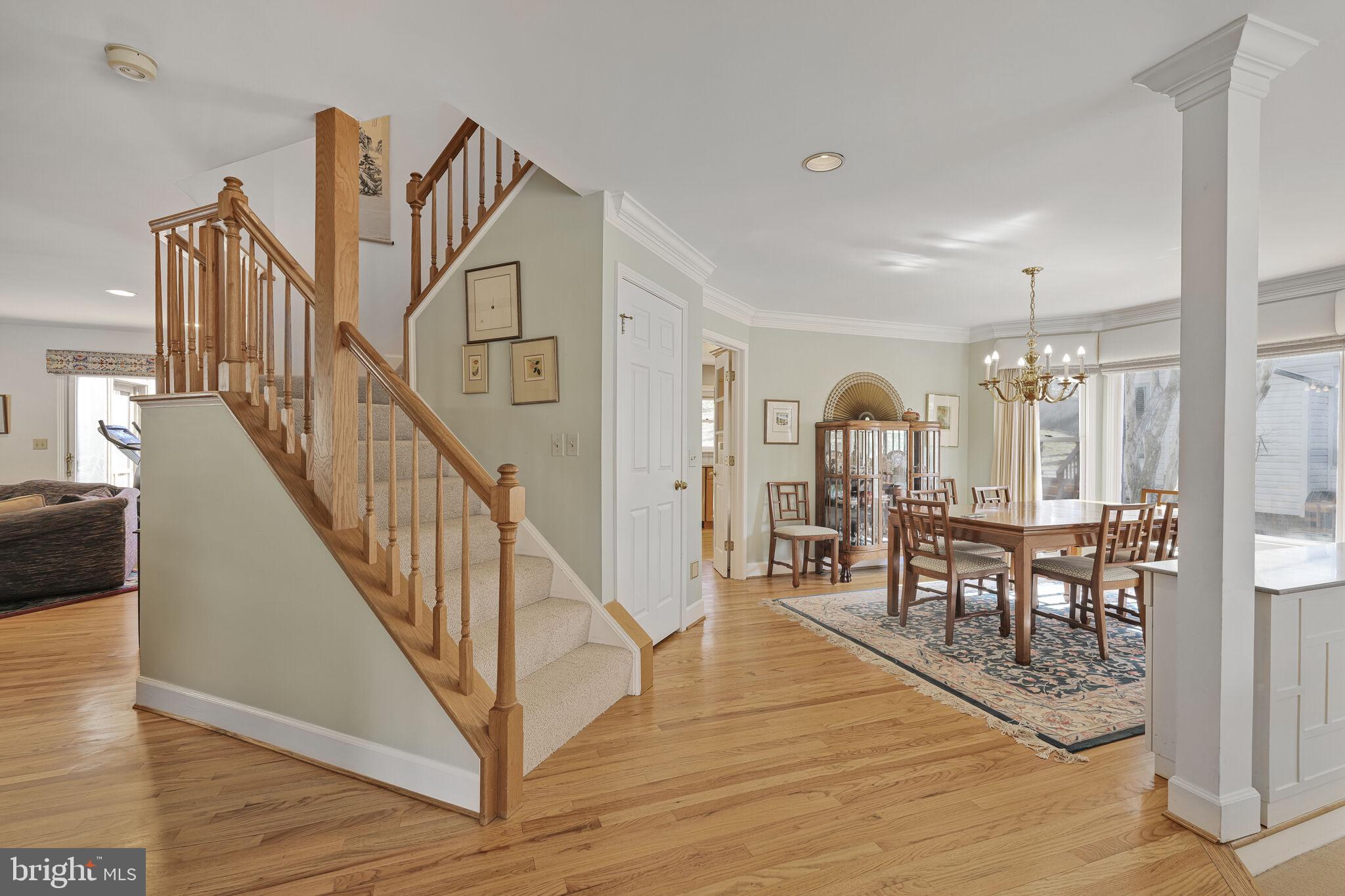 9501 Columbia Boulevard Silver Spring, MD 20910 - Photo 4 of 32 a view of a hallway with wooden floor and staircase
