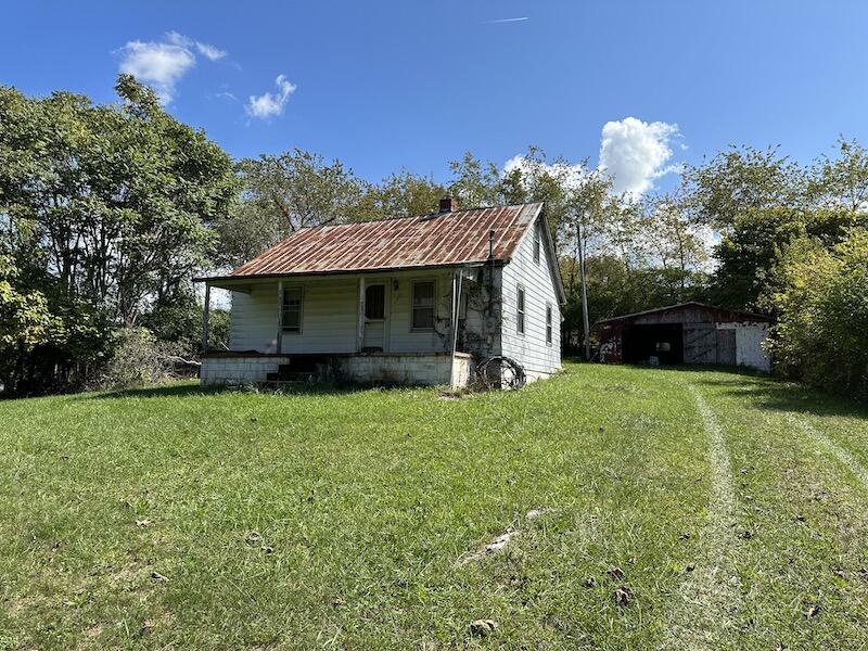 4537 Maple Branch Road Radford, VA 24141 - Photo 2 of 18 a front view of a house with garden