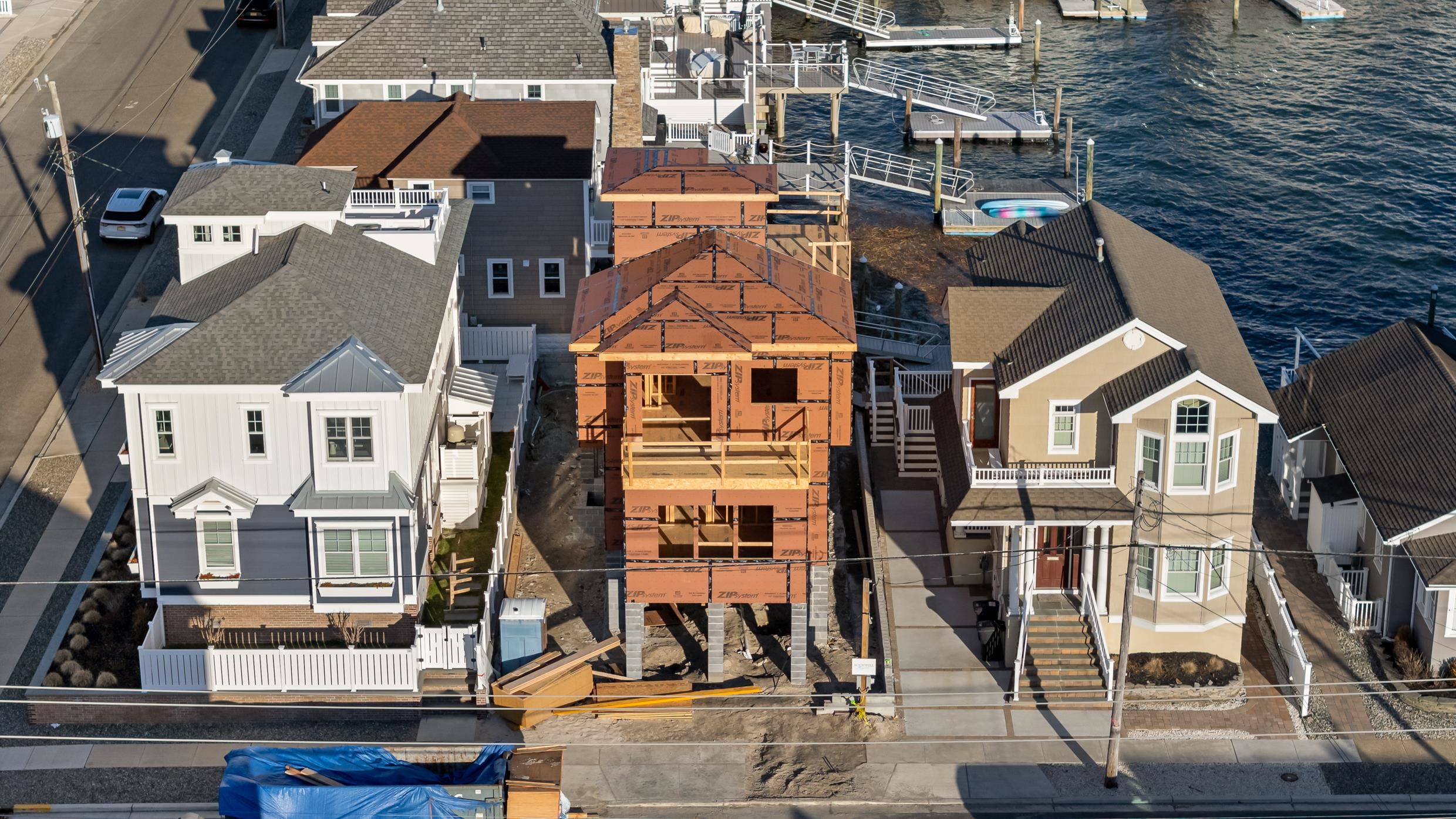 an aerial view of a residential apartment building with a yard