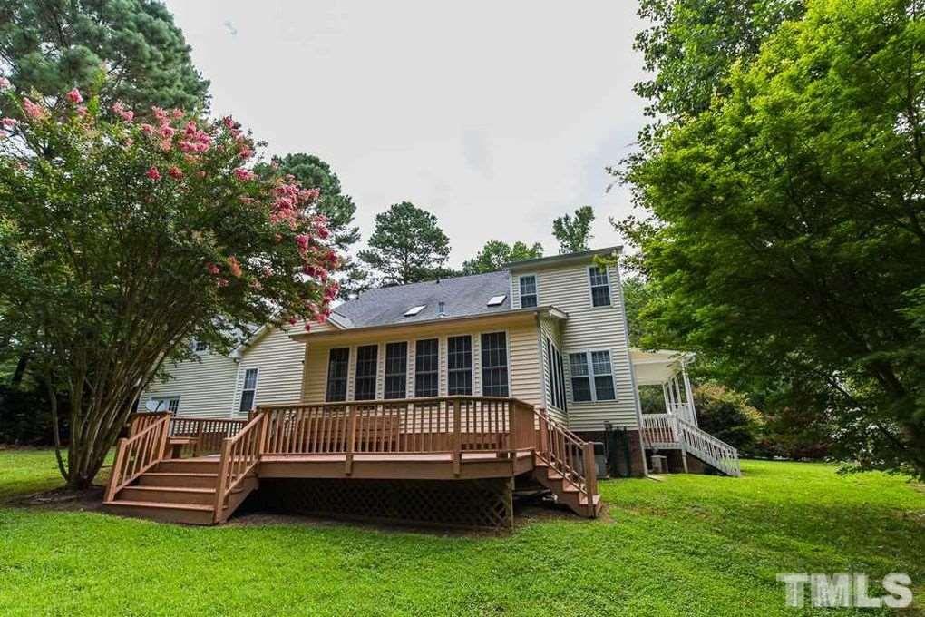 1244 Torchlight Way Raleigh, NC 27603 - Photo 2 of 20 a view of a house with a backyard and deck