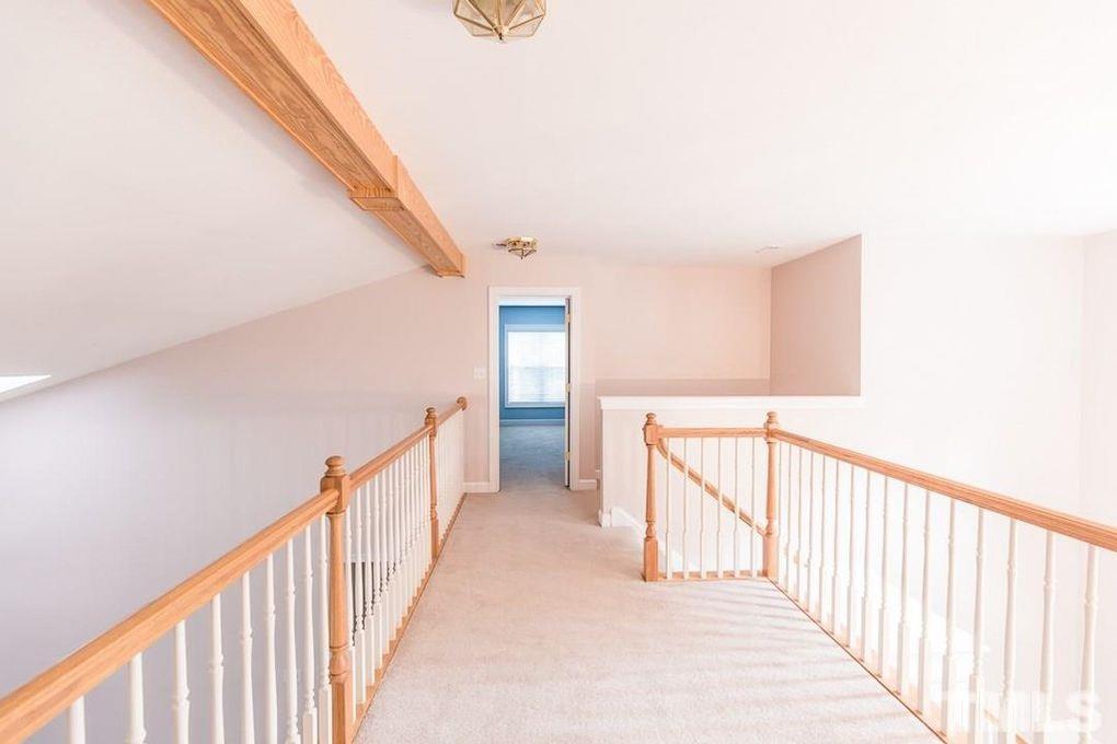 1244 Torchlight Way Raleigh, NC 27603 - Photo 16 of 20 a view of a hallway with window