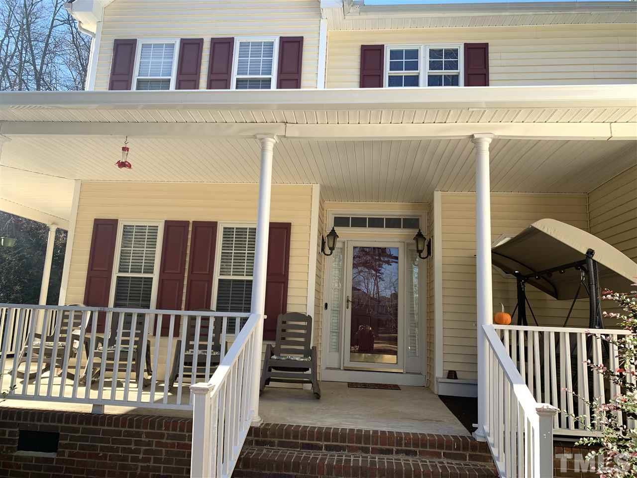 1244 Torchlight Way Raleigh, NC 27603 - Photo 6 of 20 a view of a brick house with large windows