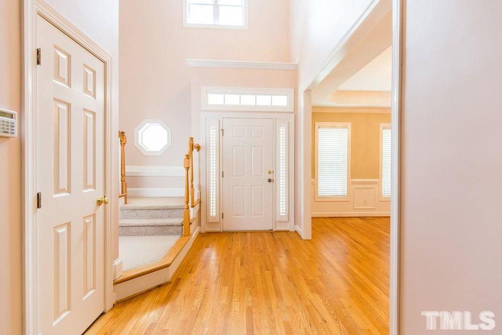 1244 Torchlight Way Raleigh, NC 27603 - Photo 8 of 20 a view of a room with wooden floor and door