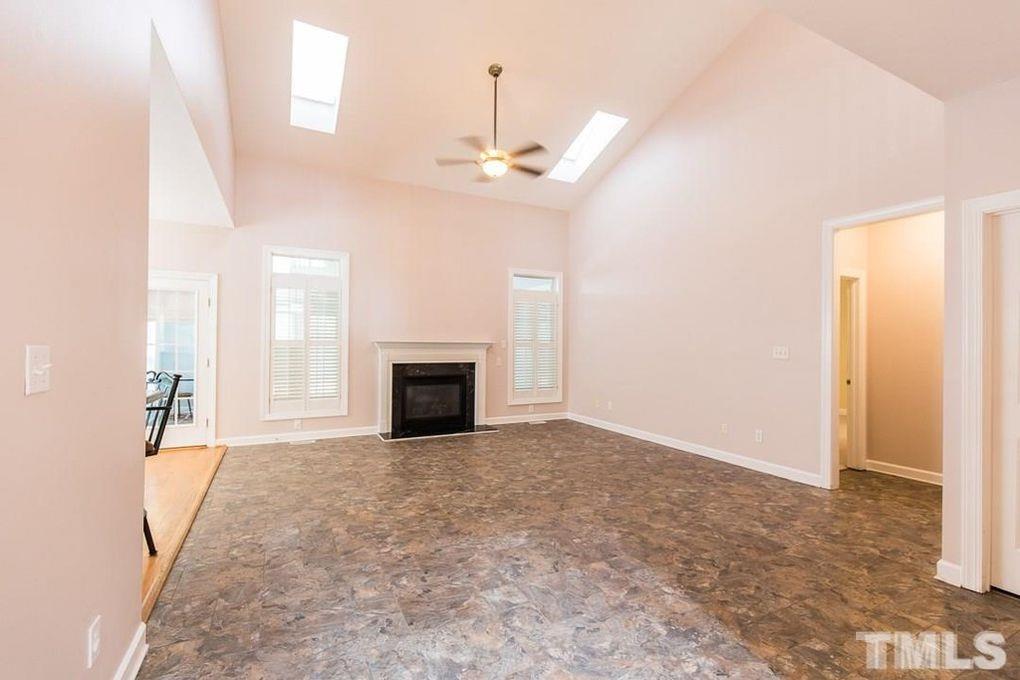 1244 Torchlight Way Raleigh, NC 27603 - Photo 10 of 20 an empty room with windows and fireplace