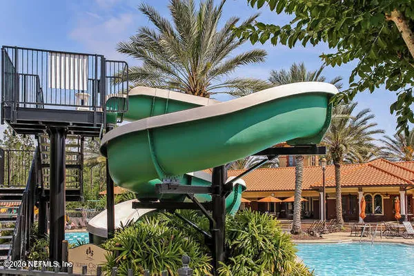 a view of a swimming pool with a patio