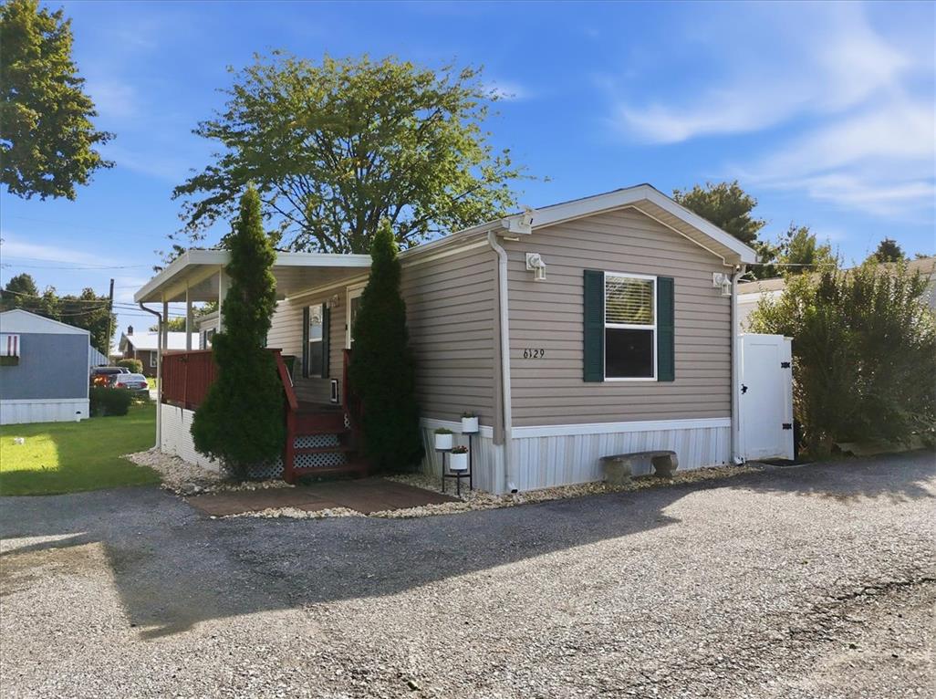 6129 Memorial Road Allentown, PA 18104 - Photo 2 of 46 Neat vinyl siding and a covered front porch create excellent curb appeal.