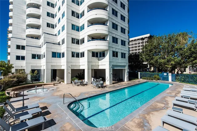 a view of building with yard in front of it