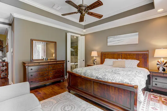 a bedroom with a bed and a dresser